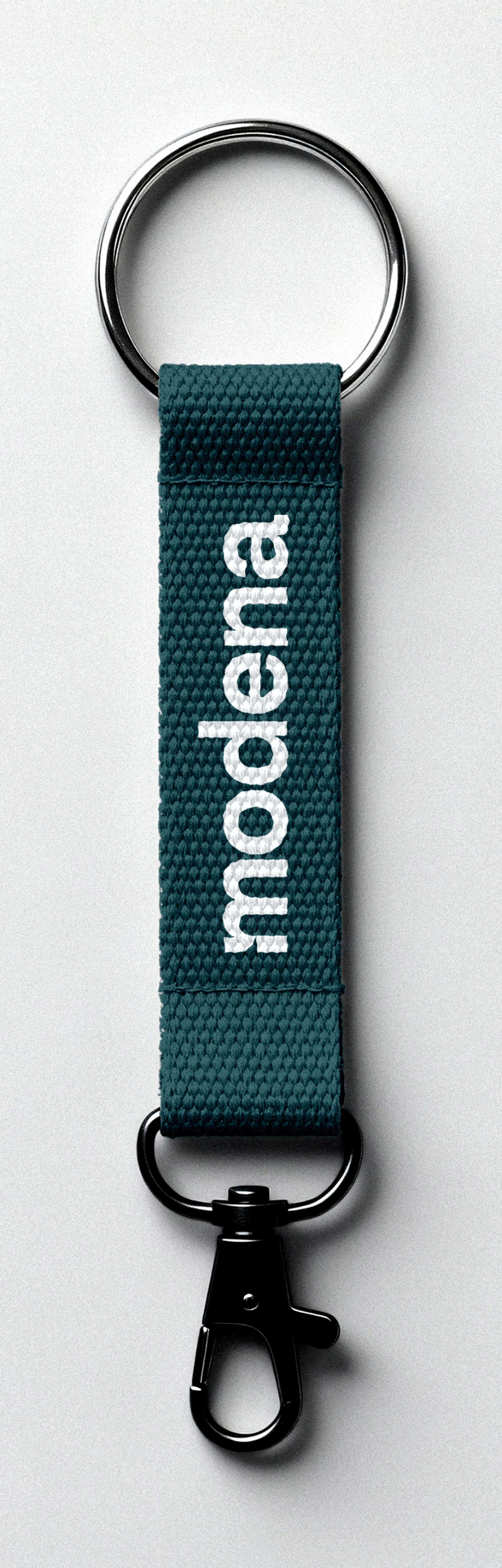 Teal Modena-branded lanyard keychain with the white logo
