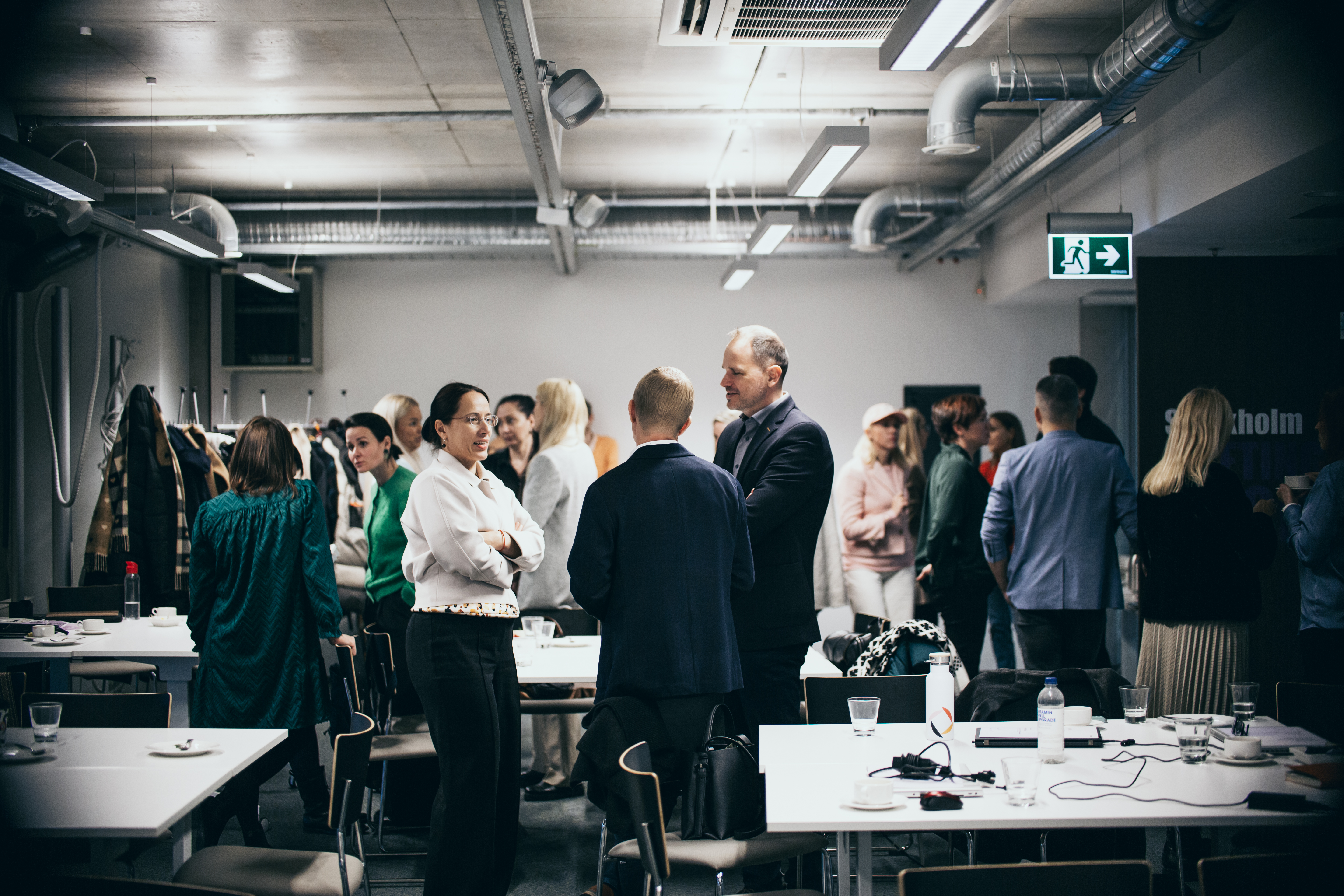 Participants networking during a break at the Omniva academy