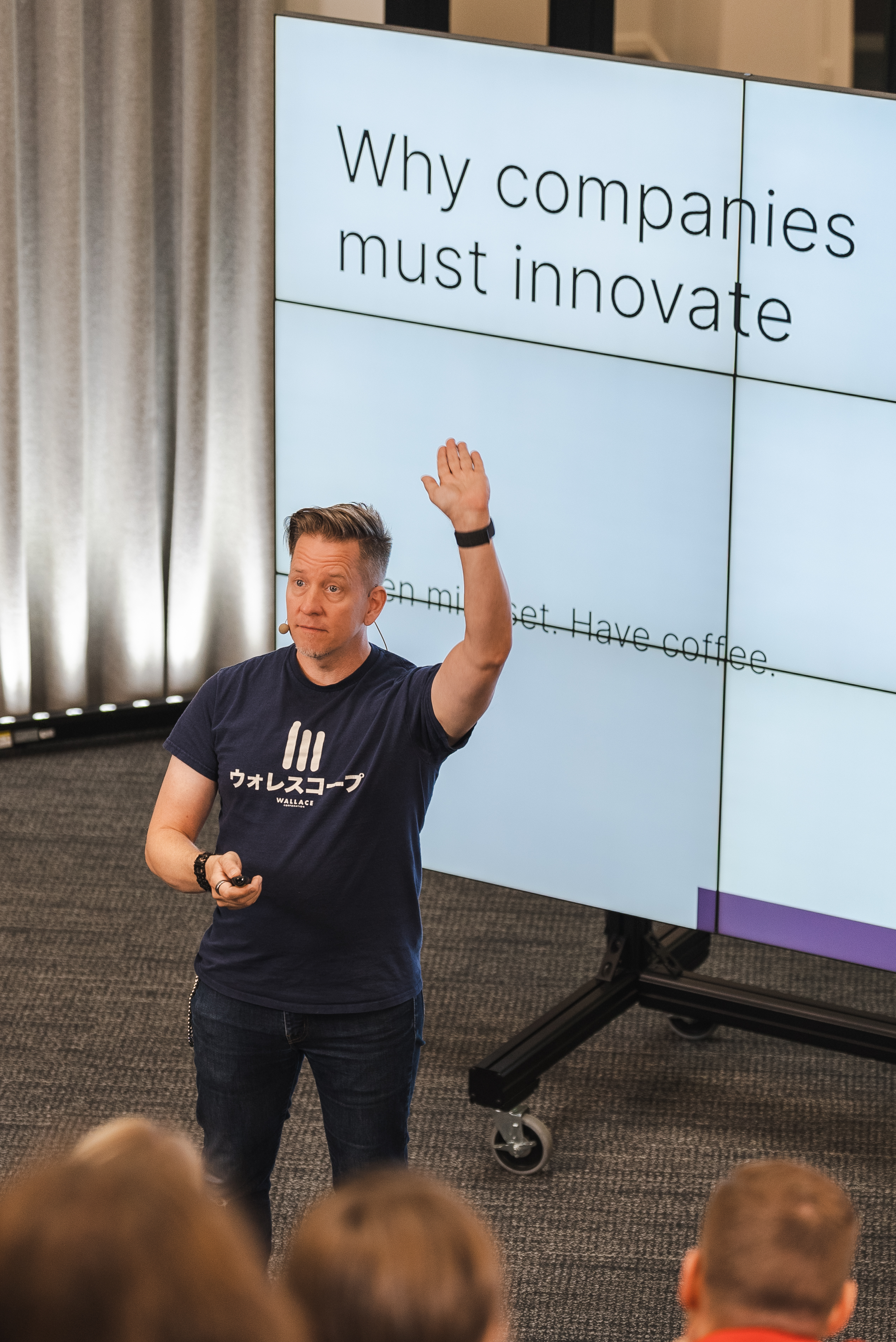 A trainer presenting a slide titled 'Why companies must innovate'